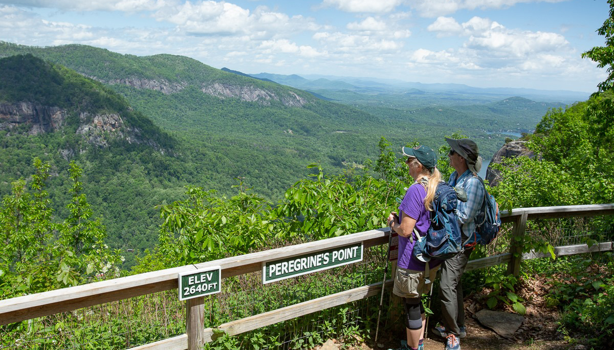 people looking out from deck at Chimney Rock Park