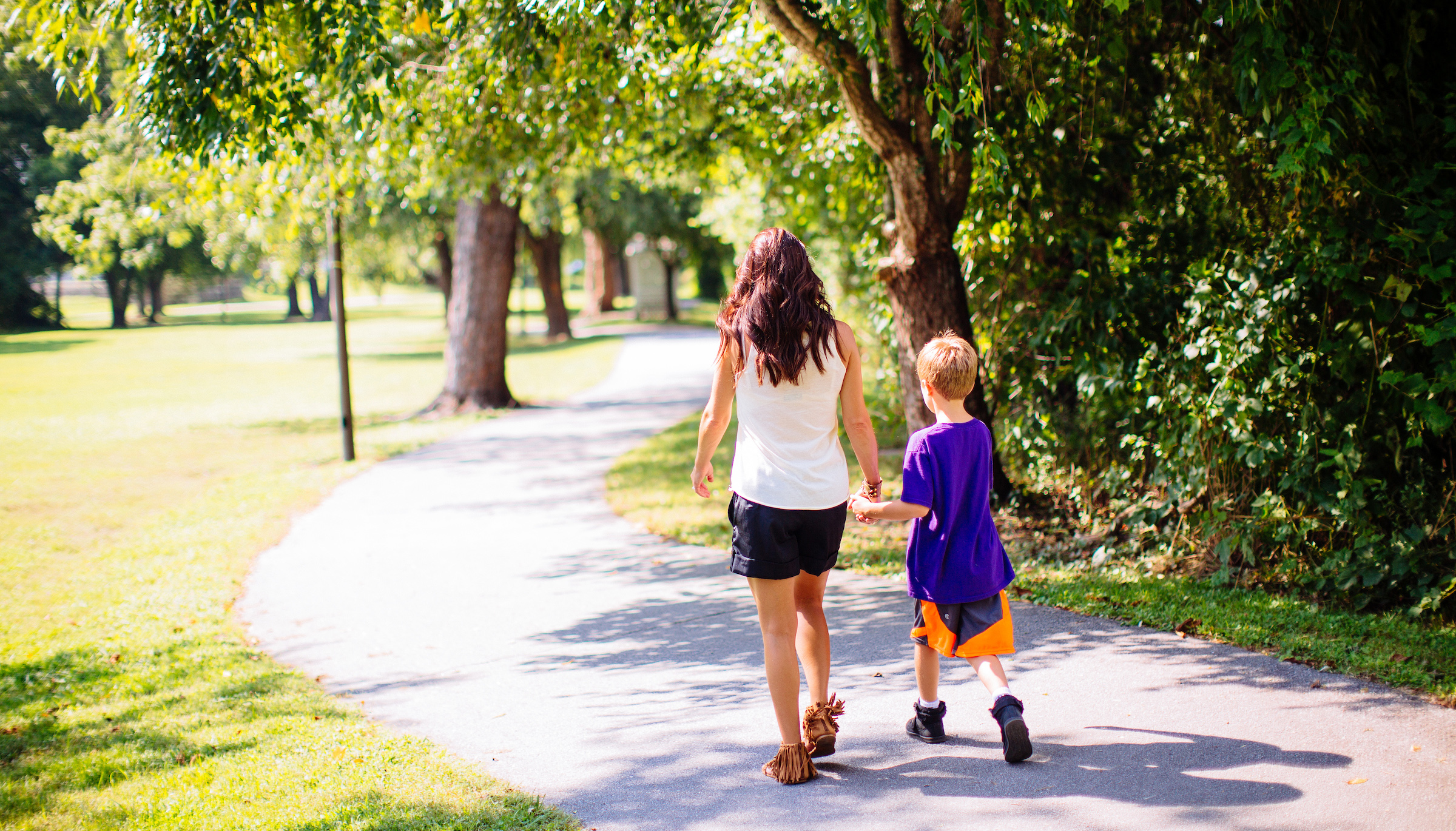 mother and son walking on oklawaha greenway