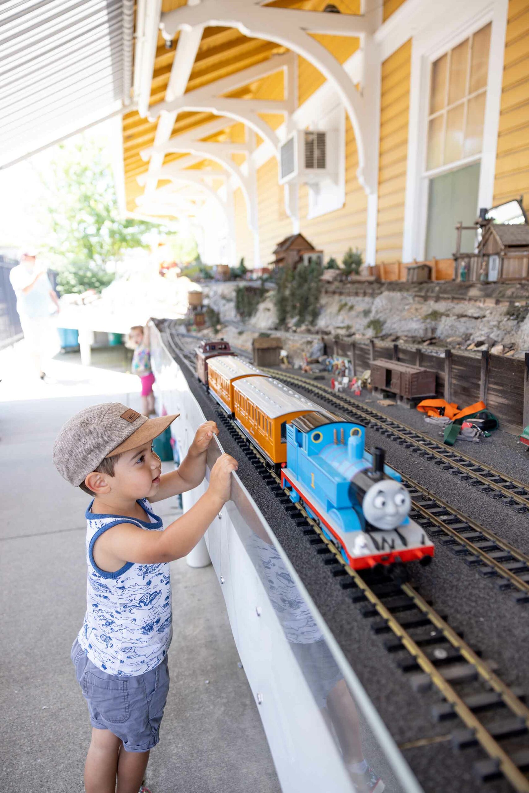 boy watching model trains